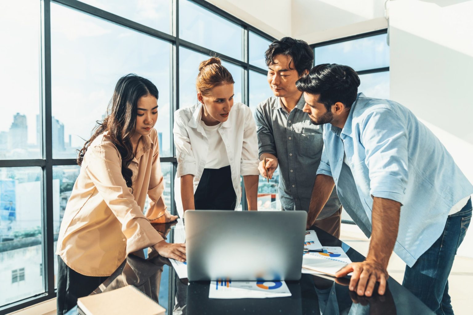 How to Develop a Robust Business: Team collaborating on strategic planning with charts, laptops, and a whiteboard in a professional setting, featuring a thumbs up and key concepts of strategic planning, business resilience, and innovation.